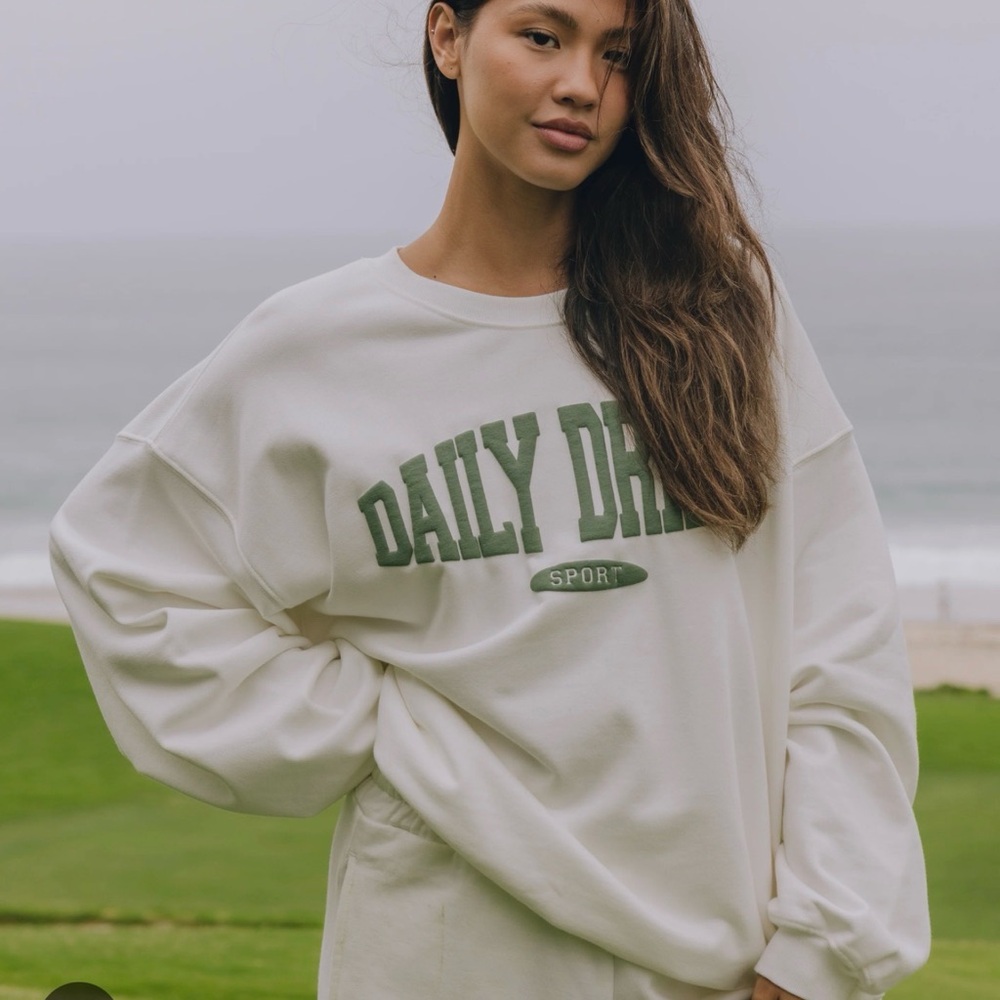 Daily Drills White Sweatshirt with Green Lettering